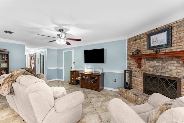 living area featuring crown molding, a brick fireplace, baseboards, and ceiling fan