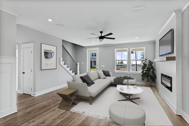 9620 Indian Stone Ct Lot 7, Navarre, FL 32566 - living area featuring visible vents, a glass covered fireplace, recessed lighting, light wood-style floors, and ceiling fan