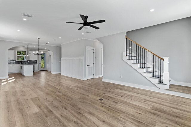 9620 Indian Stone Ct Lot 7, Navarre, FL 32566 - unfurnished living room with recessed lighting, visible vents, and ceiling fan with notable chandelier