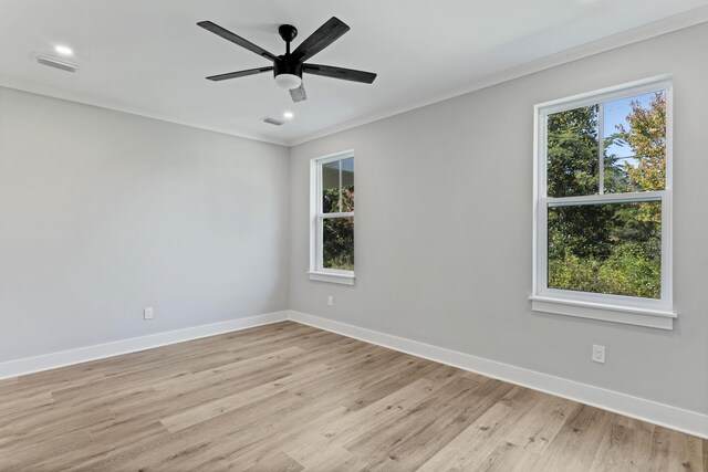 9620 Indian Stone Ct Lot 7, Navarre, FL 32566 - unfurnished room with baseboards, crown molding, visible vents, and light wood-type flooring