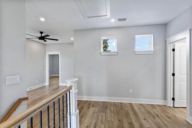 9620 Indian Stone Ct Lot 7, Navarre, FL 32566 - hallway with attic access, visible vents, recessed lighting, light wood-style floors, and an upstairs landing