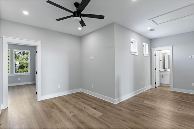 9620 Indian Stone Ct Lot 7, Navarre, FL 32566 - empty room with attic access, baseboards, recessed lighting, wood finished floors, and ceiling fan