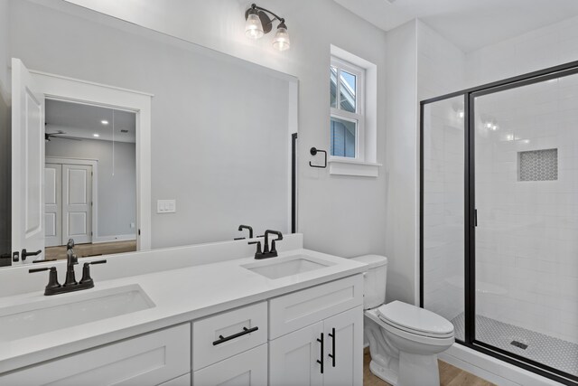 9620 Indian Stone Ct Lot 7, Navarre, FL 32566 - full bathroom featuring toilet, a sink, double vanity, and a stall shower
