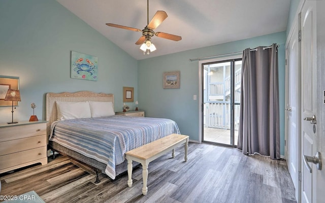 bedroom featuring wood finished floors, lofted ceiling, a ceiling fan, and access to outside