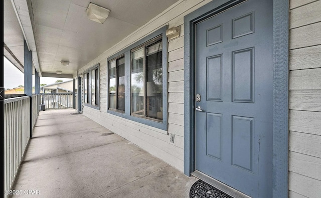 entrance to property featuring a porch