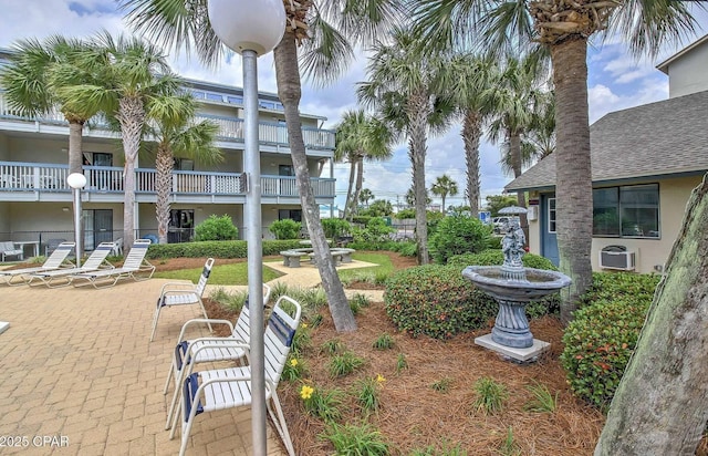 view of home's community with a patio area