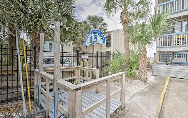 view of community featuring fence