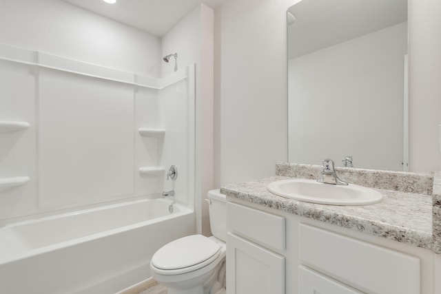 bathroom with toilet, bathing tub / shower combination, and vanity