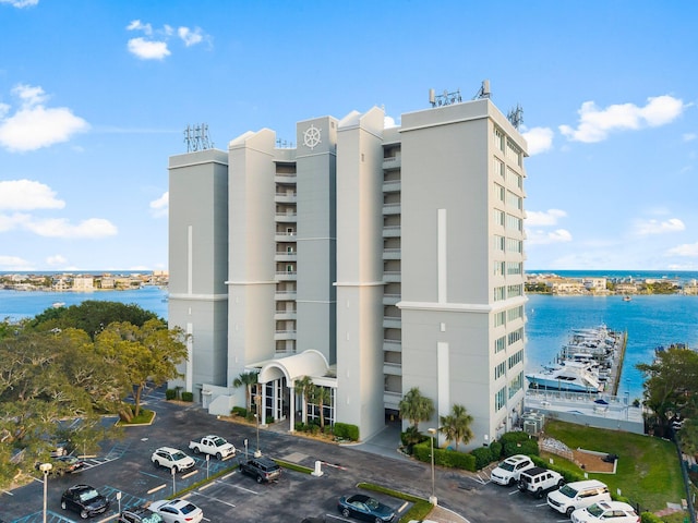 320 Harbor Blvd Unit 1201, Destin, FL 32541 - view of building exterior with a water view and uncovered parking