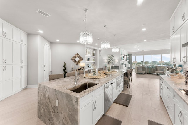 320 Harbor Blvd Unit 1201, Destin, FL 32541 - kitchen with a sink, recessed lighting, open floor plan, a large island, and stainless steel dishwasher