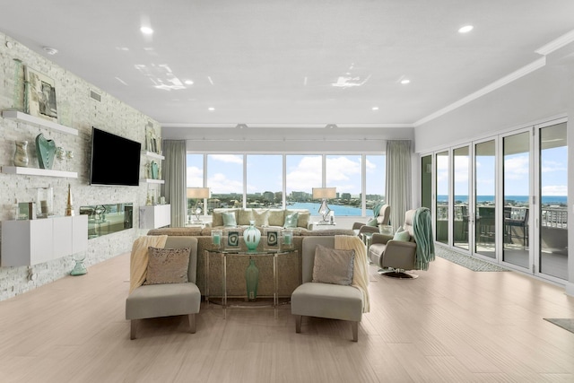 320 Harbor Blvd Unit 1201, Destin, FL 32541 - interior space featuring a fireplace, recessed lighting, a water view, visible vents, and ornamental molding
