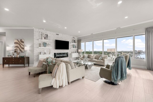 320 Harbor Blvd Unit 1201, Destin, FL 32541 - living area with recessed lighting, baseboards, crown molding, and a stone fireplace