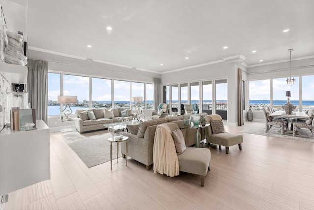 320 Harbor Blvd Unit 1201, Destin, FL 32541 - living room featuring crown molding, a healthy amount of sunlight, and light wood-type flooring