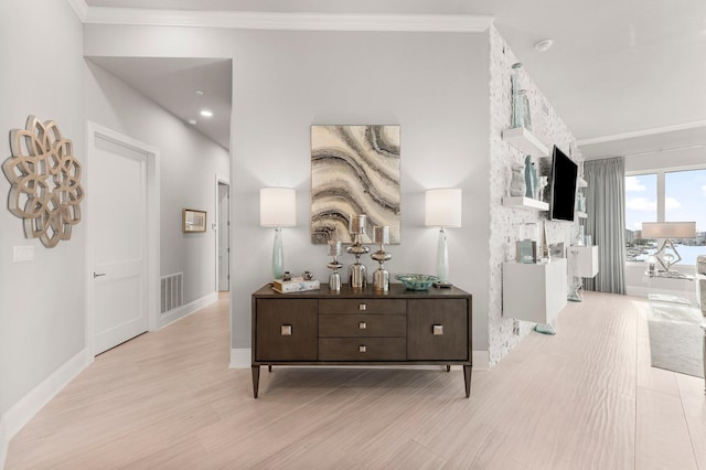 320 Harbor Blvd Unit 1201, Destin, FL 32541 - hall featuring baseboards, visible vents, ornamental molding, and wood finished floors