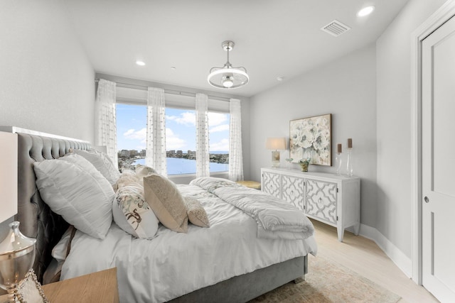 320 Harbor Blvd Unit 1201, Destin, FL 32541 - bedroom featuring light wood-style flooring, recessed lighting, baseboards, a water view, and visible vents
