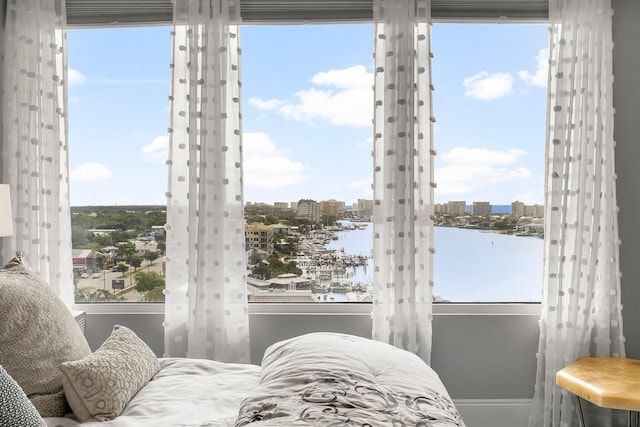 320 Harbor Blvd Unit 1201, Destin, FL 32541 - bedroom featuring a view of city, a water view, and baseboards