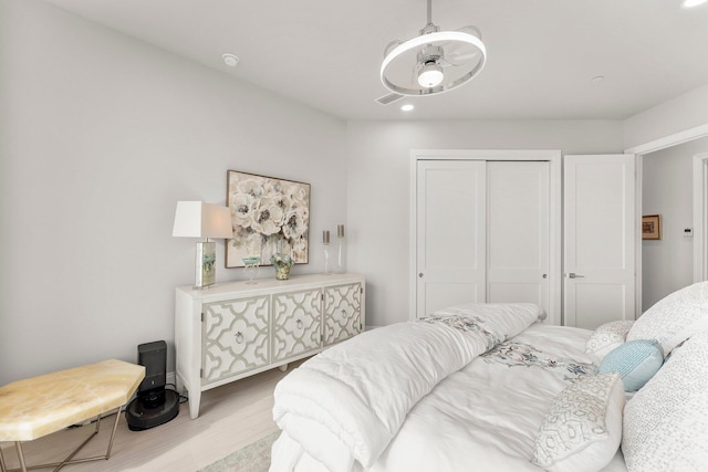 320 Harbor Blvd Unit 1201, Destin, FL 32541 - bedroom with a closet, recessed lighting, and wood finished floors