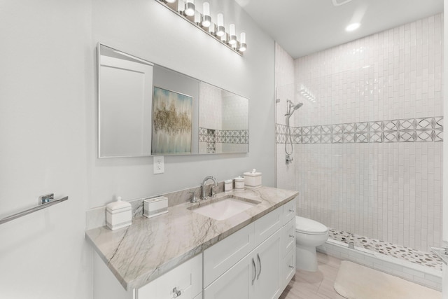 320 Harbor Blvd Unit 1201, Destin, FL 32541 - bathroom with vanity, toilet, and tiled shower