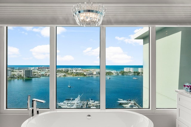 320 Harbor Blvd Unit 1201, Destin, FL 32541 - full bathroom with a water view, a freestanding bath, and a healthy amount of sunlight
