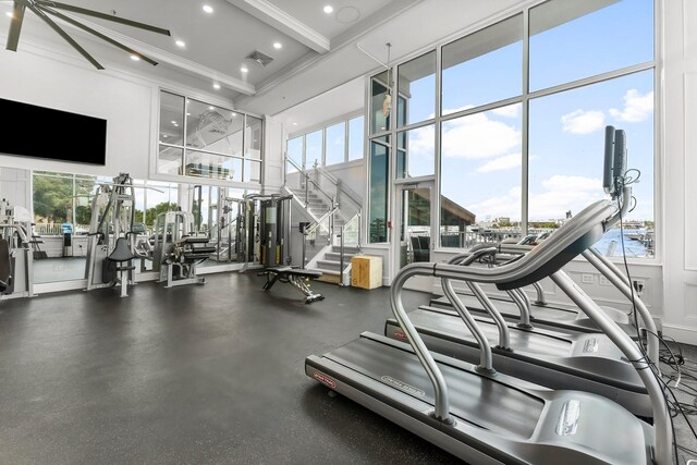 320 Harbor Blvd Unit 1201, Destin, FL 32541 - workout area featuring crown molding, a high ceiling, recessed lighting, and visible vents