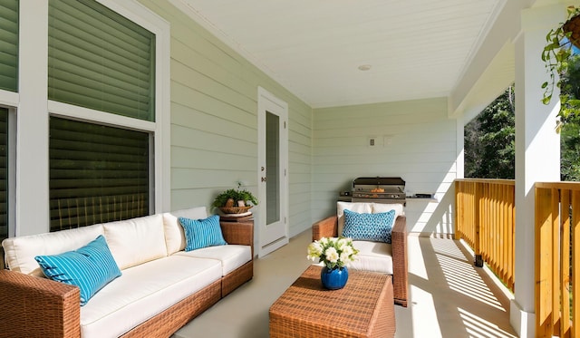 58 Eunola Ln, Freeport, FL 32439 - balcony featuring a porch, an outdoor hangout area, and a grill