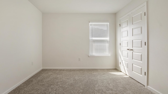 58 Eunola Ln, Freeport, FL 32439 - unfurnished bedroom featuring baseboards and carpet floors