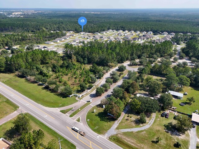 58 Eunola Ln, Freeport, FL 32439 - bird's eye view with a wooded view