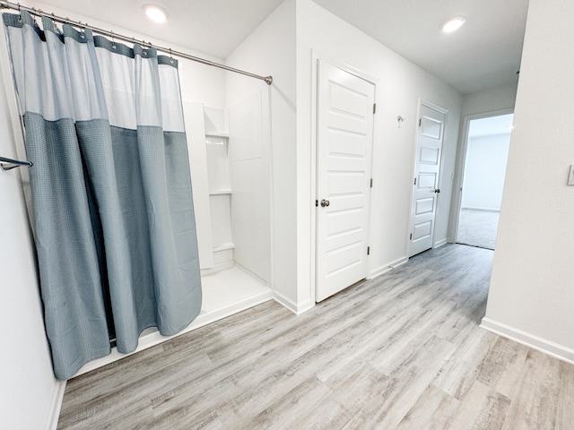58 Eunola Ln, Freeport, FL 32439 - full bath with baseboards, recessed lighting, wood finished floors, and a shower with shower curtain