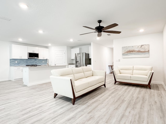 58 Eunola Ln, Freeport, FL 32439 - living area with recessed lighting, a ceiling fan, baseboards, and light wood-style floors