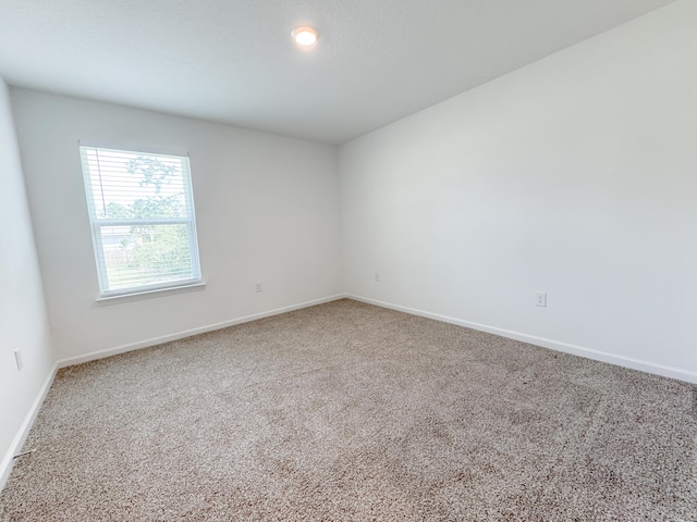58 Eunola Ln, Freeport, FL 32439 - carpeted empty room featuring baseboards