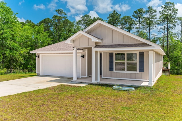 6629 Spyglass Hill Rd, Laurel Hill, FL 32567 - view of front of house with board and batten siding, concrete driveway, a shingled roof, and a garage