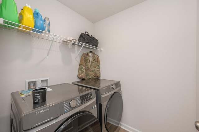 6629 Spyglass Hill Rd, Laurel Hill, FL 32567 - laundry area featuring laundry area, washer and clothes dryer, baseboards, and wood finished floors
