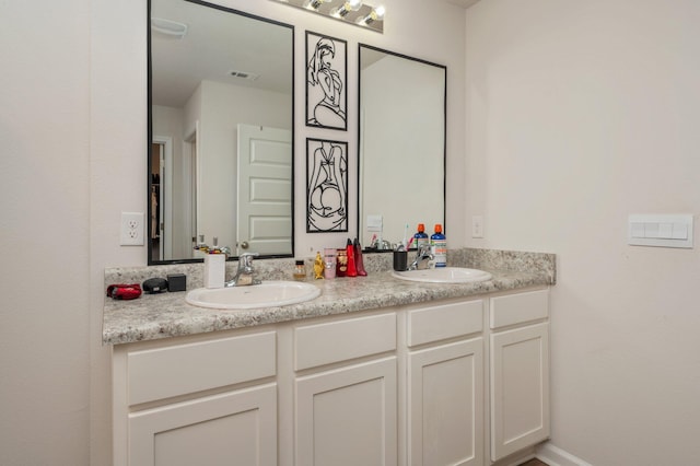 6629 Spyglass Hill Rd, Laurel Hill, FL 32567 - full bathroom with a sink, double vanity, and visible vents