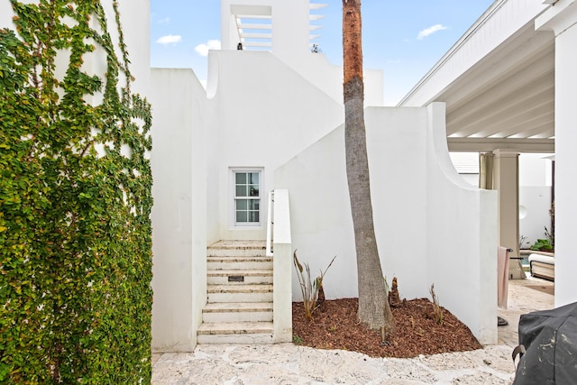 30 N Charles St, Inlet Beach, FL 32461 - doorway to property with stucco siding