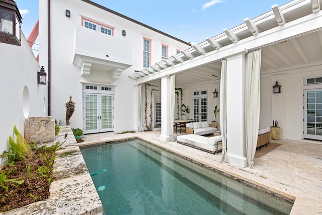 30 N Charles St, Inlet Beach, FL 32461 - rear view of property featuring an outdoor pool, a patio area, a pergola, stucco siding, and french doors