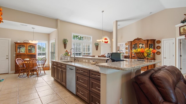 174 Mango Ln, Freeport, FL 32439 - kitchen with dishwasher, light tile patterned floors, a sink, light stone countertops, and pendant lighting