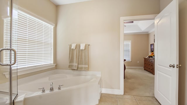 174 Mango Ln, Freeport, FL 32439 - full bath featuring a bath, tile patterned floors, and baseboards