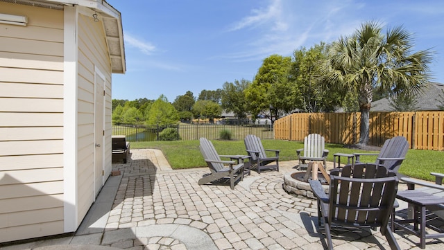 174 Mango Ln, Freeport, FL 32439 - view of patio / terrace with a fire pit and a fenced backyard