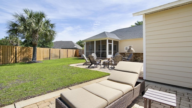 174 Mango Ln, Freeport, FL 32439 - view of yard featuring fence private yard, a sunroom, an outdoor living space with a fire pit, and a patio