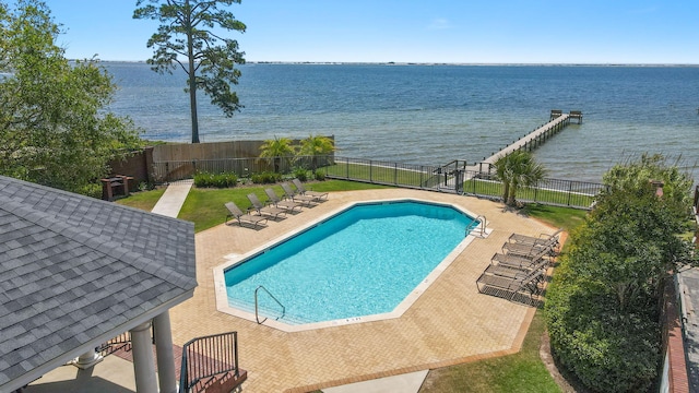 9124 Orlando Ave, Navarre, FL 32566 - community pool with a water view, fence, and a patio area