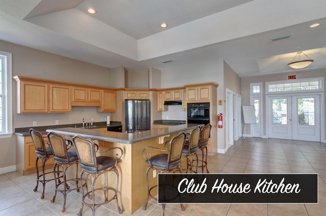 9124 Orlando Ave, Navarre, FL 32566 - kitchen featuring a raised ceiling, freestanding refrigerator, baseboards, a sink, and recessed lighting