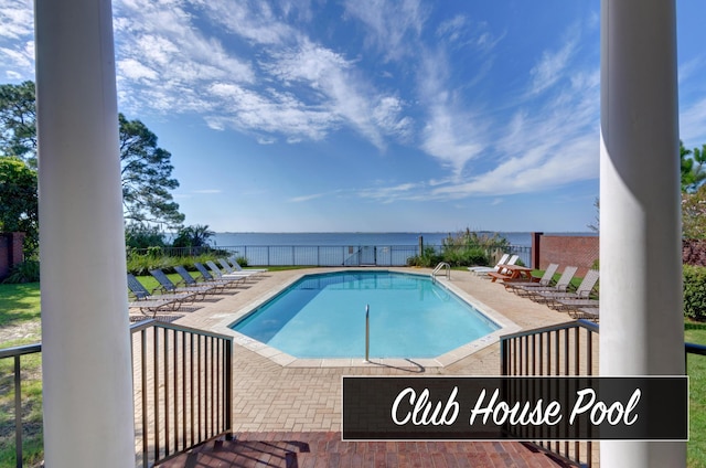 9124 Orlando Ave, Navarre, FL 32566 - community pool featuring a patio area, a water view, and fence