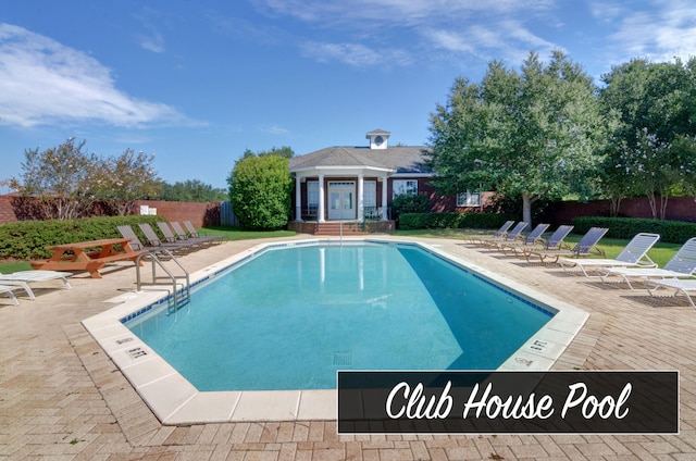 9124 Orlando Ave, Navarre, FL 32566 - community pool with a patio area and fence