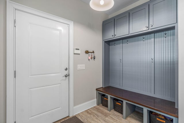 9124 Orlando Ave, Navarre, FL 32566 - mudroom with baseboards and light wood finished floors
