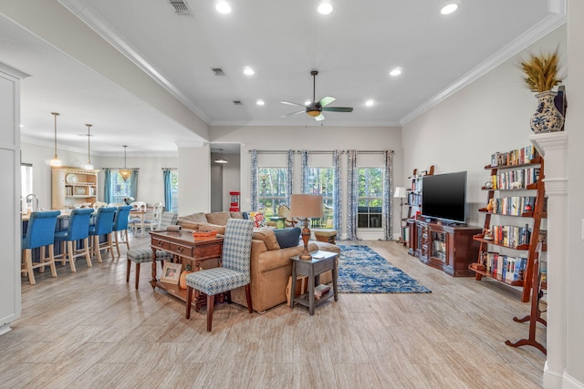 9124 Orlando Ave, Navarre, FL 32566 - living room featuring ceiling fan, recessed lighting, light wood finished floors, and crown molding