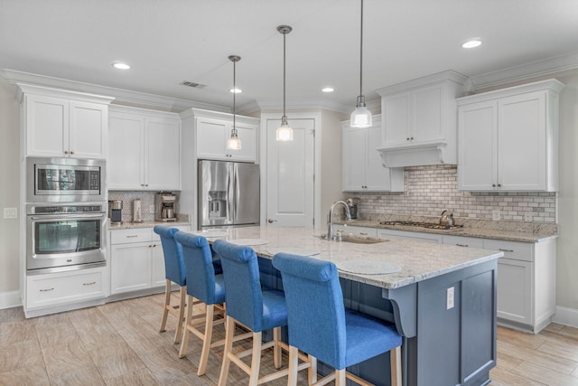 9124 Orlando Ave, Navarre, FL 32566 - kitchen with stainless steel appliances, a sink, decorative backsplash, white cabinetry, and ornamental molding