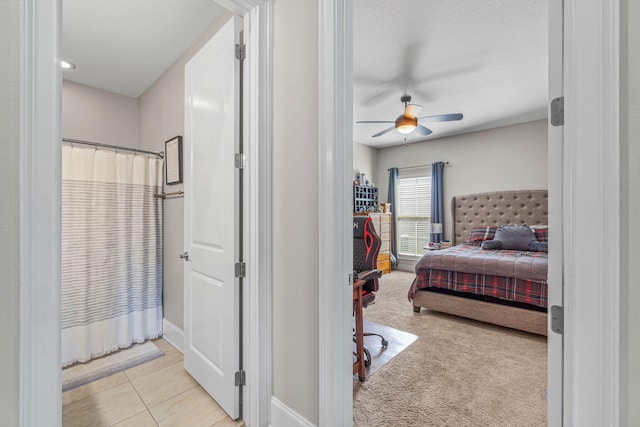 9124 Orlando Ave, Navarre, FL 32566 - carpeted bedroom featuring a ceiling fan and tile patterned flooring