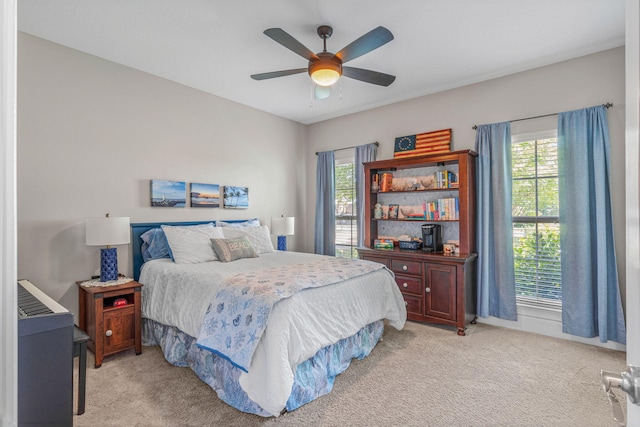 9124 Orlando Ave, Navarre, FL 32566 - bedroom featuring carpet, multiple windows, ceiling fan, and baseboards