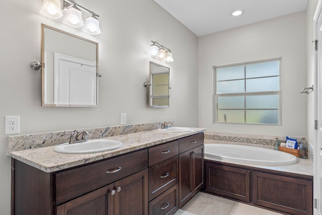 9124 Orlando Ave, Navarre, FL 32566 - full bath with a garden tub, double vanity, and tile patterned floors