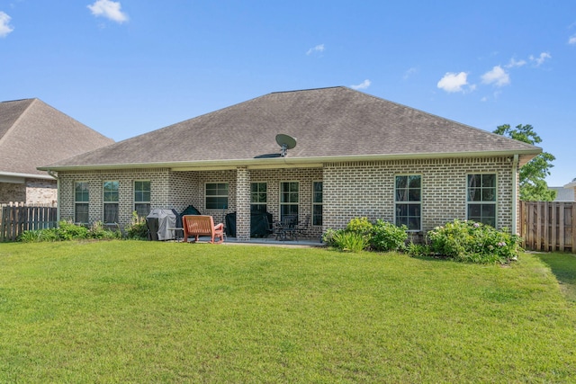 9124 Orlando Ave, Navarre, FL 32566 - back of property with brick siding, a shingled roof, and a patio area